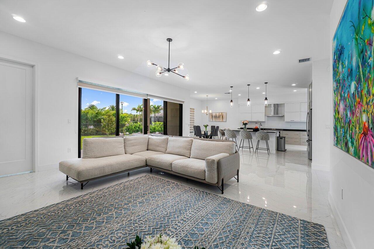 17092 Teton River Road Boca Raton, FL 33496 - Photo 6 of 58 a living room with furniture and a large window