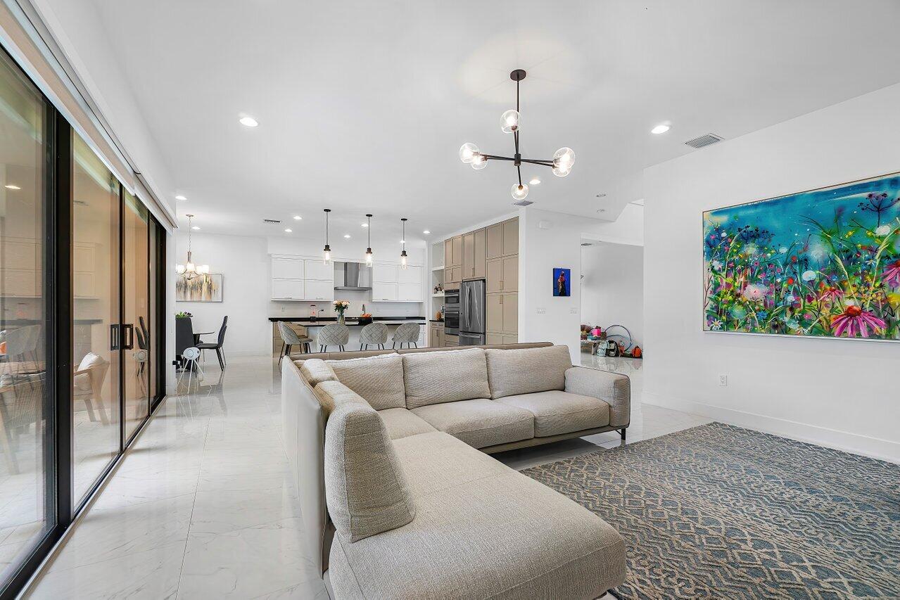17092 Teton River Road Boca Raton, FL 33496 - Photo 7 of 58 a living room with furniture kitchen and a view of kitchen