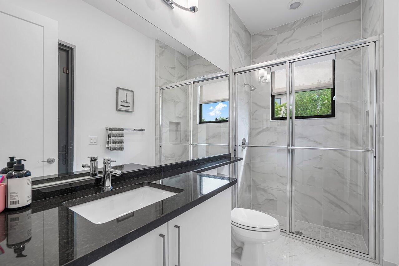 17092 Teton River Road Boca Raton, FL 33496 - Photo 9 of 58 a bathroom with a sink and a mirror