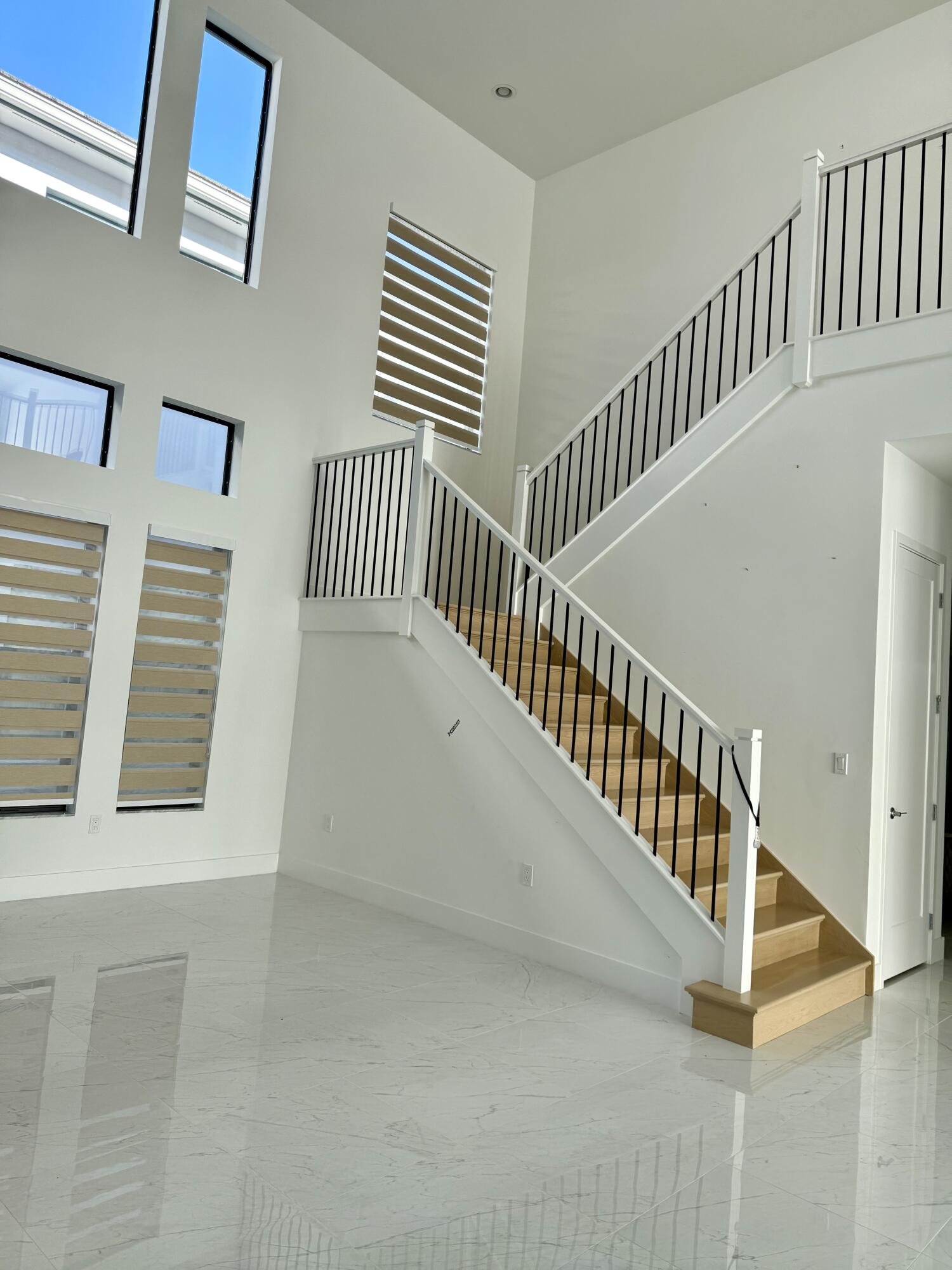 17092 Teton River Road Boca Raton, FL 33496 - Photo 10 of 58 a view of staircase with white walls and a window