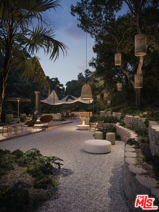 6489 Cavalleri Road, Unit 304 Malibu, CA 90265 - Photo 11 of 17 a row of palm trees in front of a house
