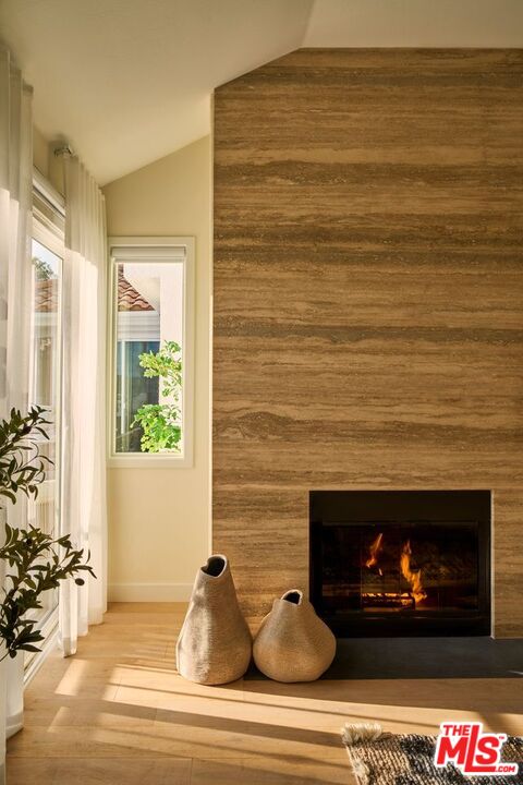 6489 Cavalleri Road, Unit 304 Malibu, CA 90265 - Photo 3 of 17 a living room with fireplace furniture and a fireplace