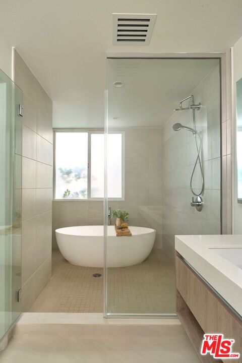 6489 Cavalleri Road, Unit 304 Malibu, CA 90265 - Photo 5 of 17 a bathroom with a sink and a mirror