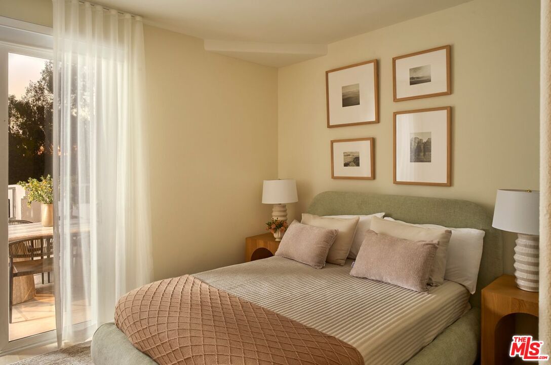 6489 Cavalleri Road, Unit 304 Malibu, CA 90265 - Photo 6 of 17 a bedroom with a bed and a window