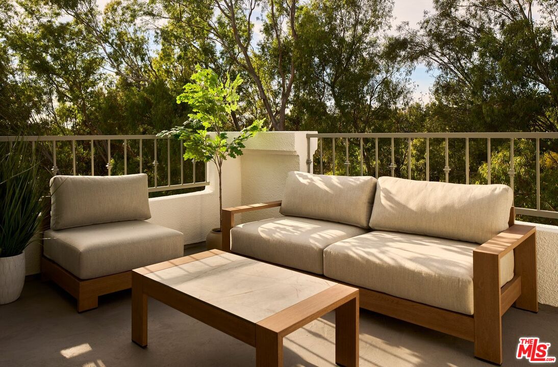 6489 Cavalleri Road, Unit 304 Malibu, CA 90265 - Photo 8 of 17 a balcony with furniture and a potted plant