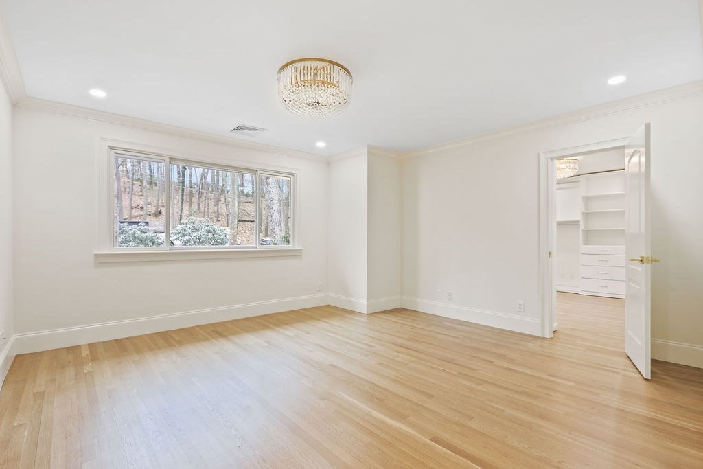 80 Doublet Hill Road Weston, MA 02493 - Photo 32 of 38 wooden floor in an empty room with a window