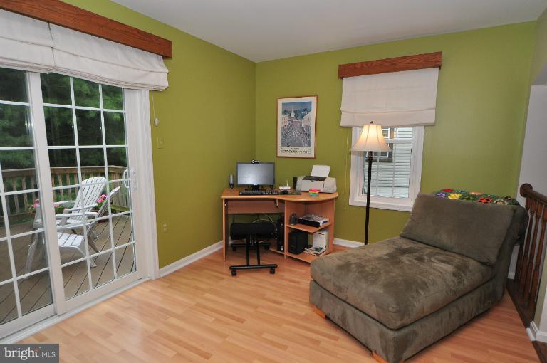 11958 Sentinel Point Court Reston, VA 20191 - Photo 3 of 26 The family room leads to the main deck.