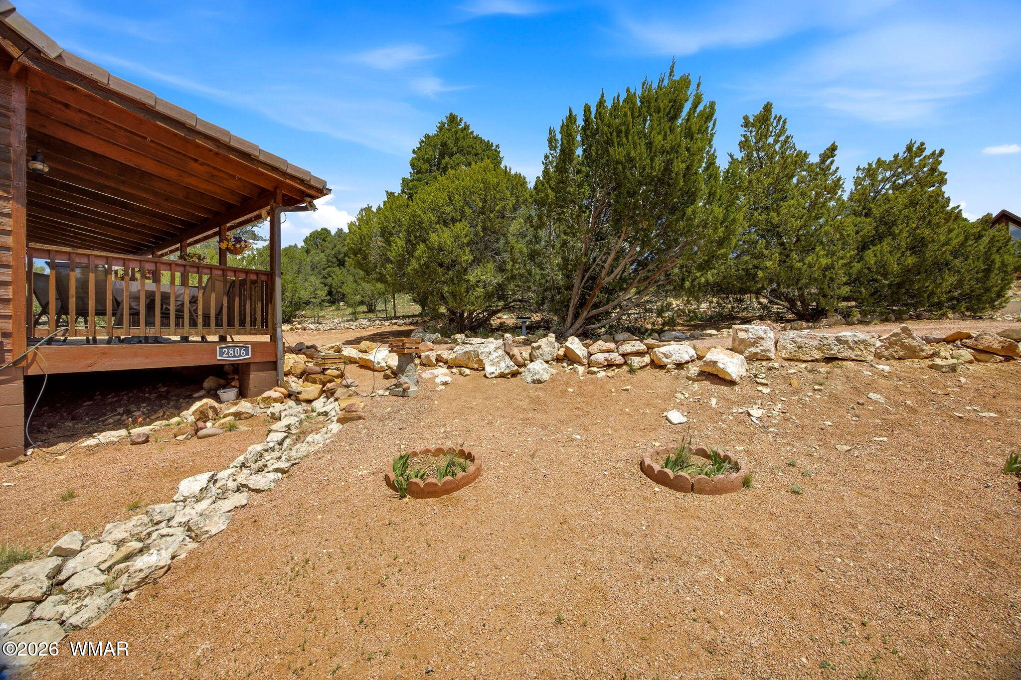 2806 Sky Hawk Drive Overgaard, AZ 85933 - Photo 3 of 43 a view of a wooden house with a yard