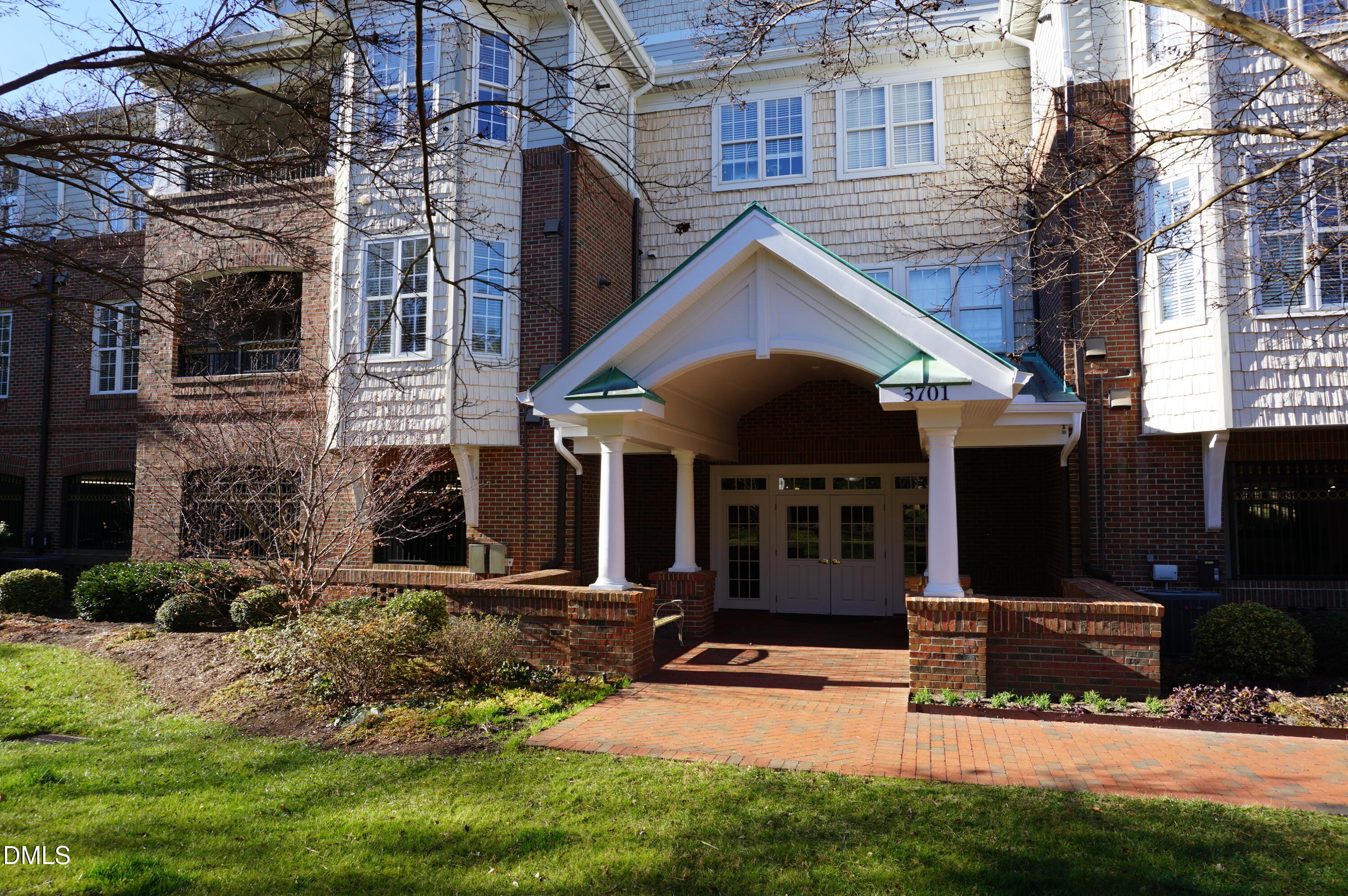 a view of a house with yard and sitting area