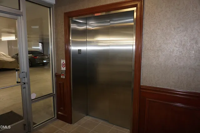 a bathroom with a glass door shower