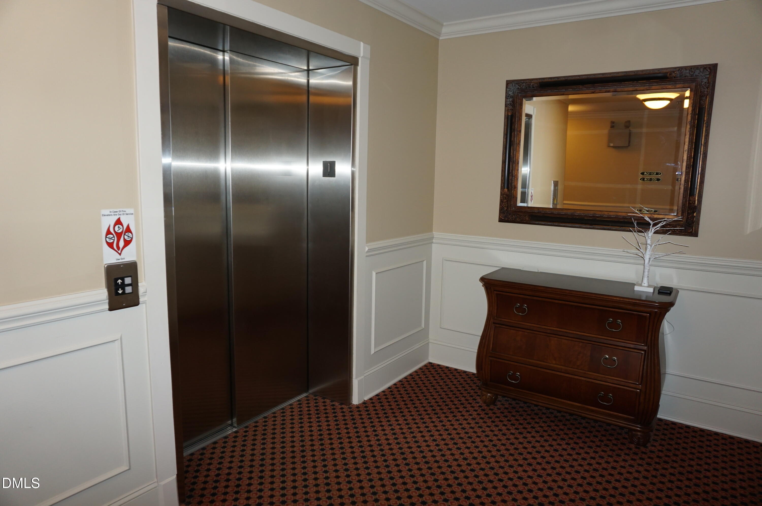 3701 Baron Cooper Pass, Unit 104 Raleigh, NC 27612 - Photo 13 of 52 a bathroom with a sink and a mirror