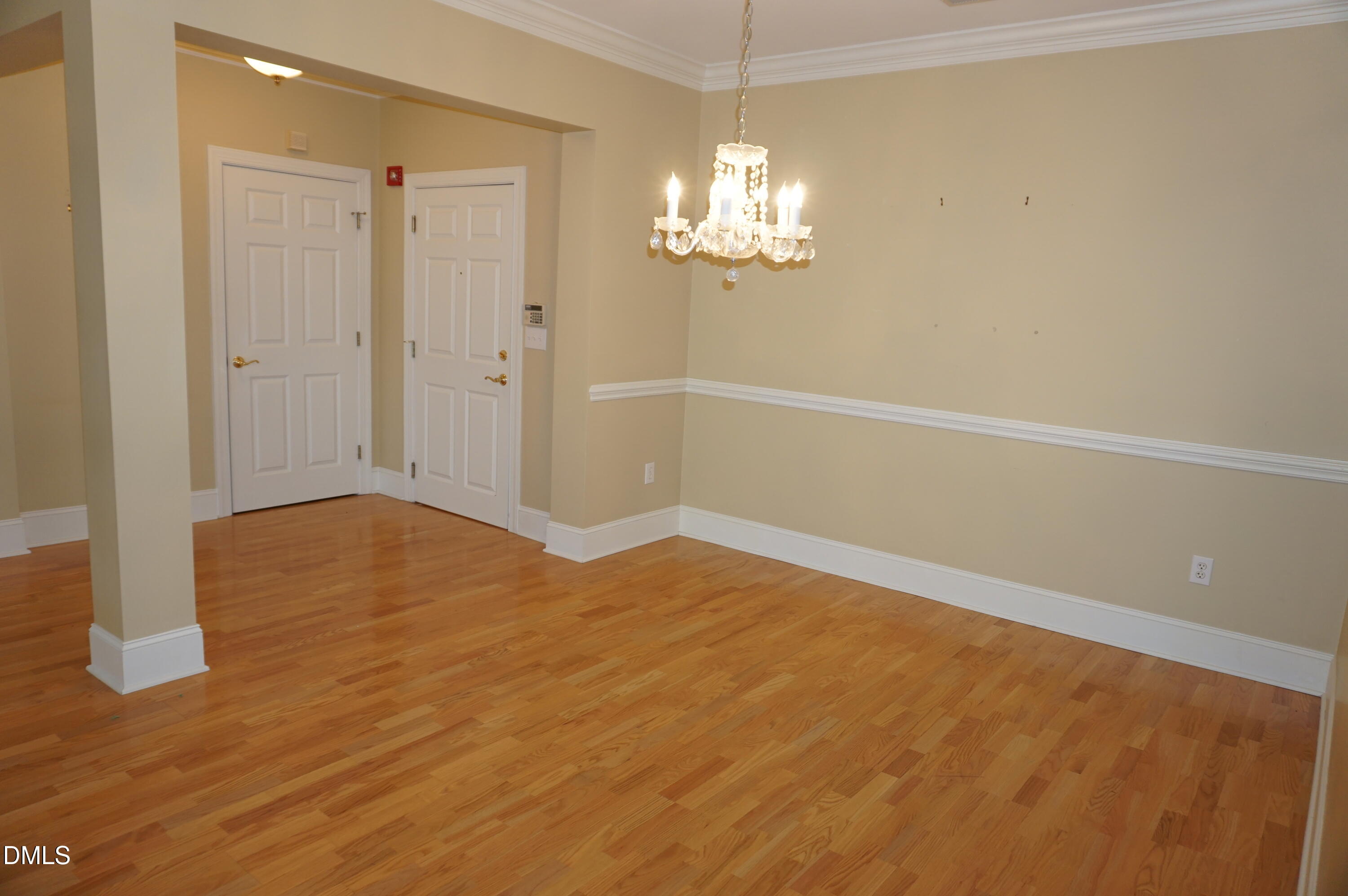 3701 Baron Cooper Pass, Unit 104 Raleigh, NC 27612 - Photo 19 of 52 a view of empty room with wooden floor
