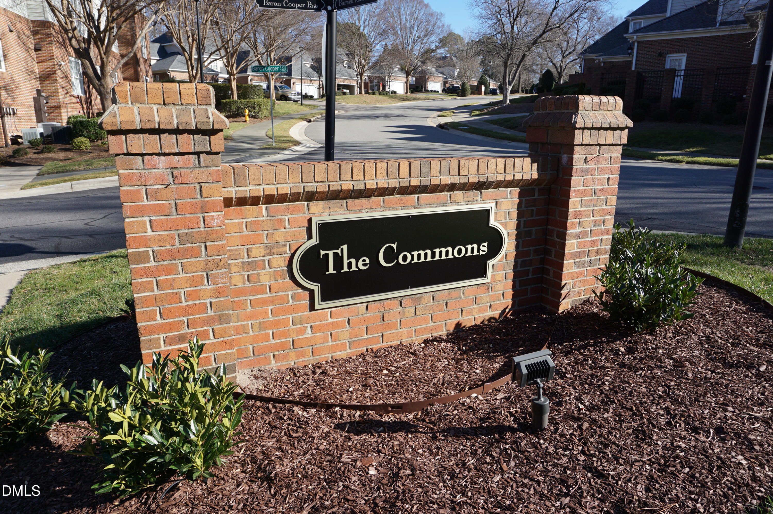 3701 Baron Cooper Pass, Unit 104 Raleigh, NC 27612 - Photo 2 of 52 a sign on the side of a building