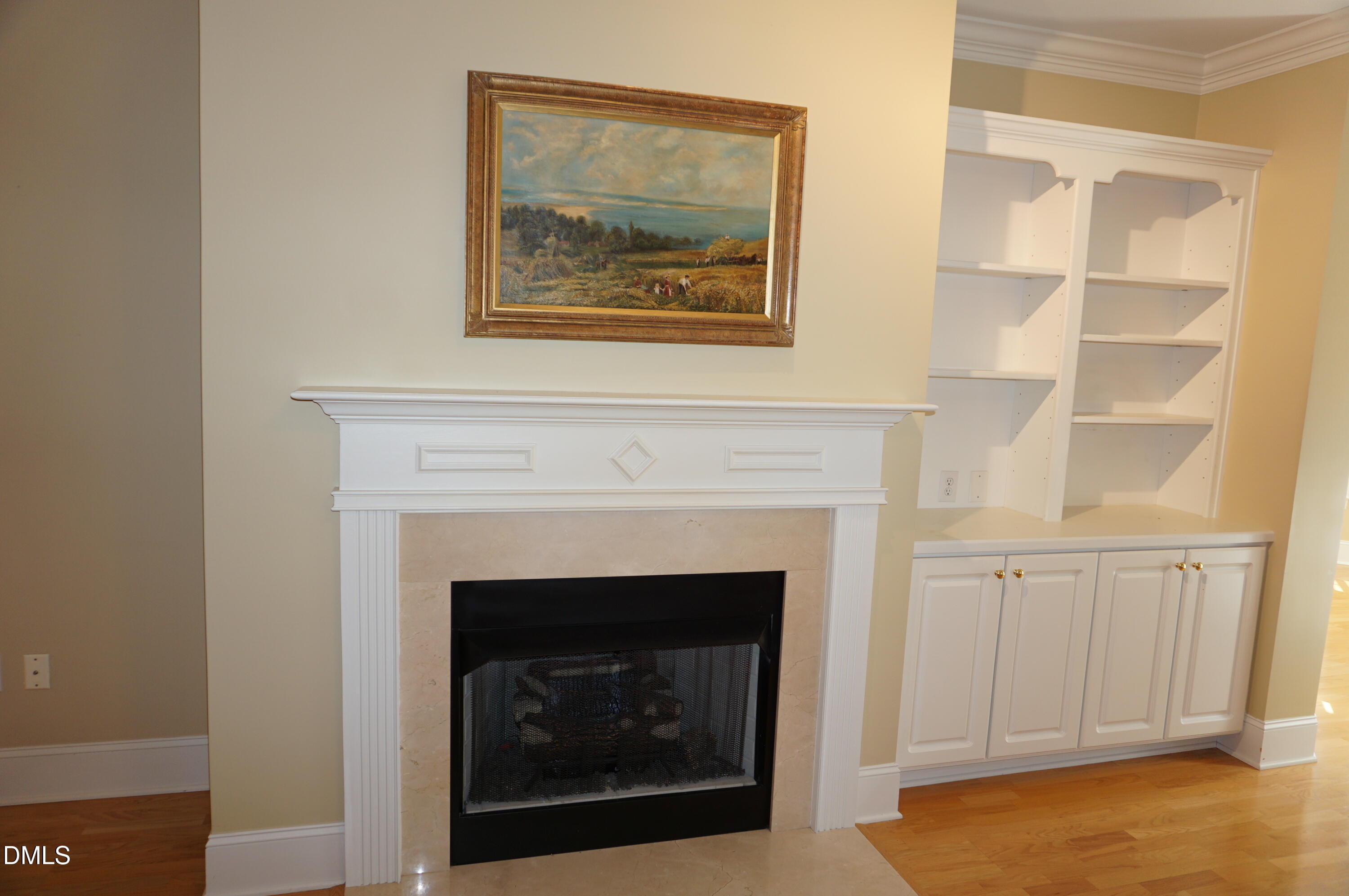 3701 Baron Cooper Pass, Unit 104 Raleigh, NC 27612 - Photo 22 of 52 a living room with a fireplace
