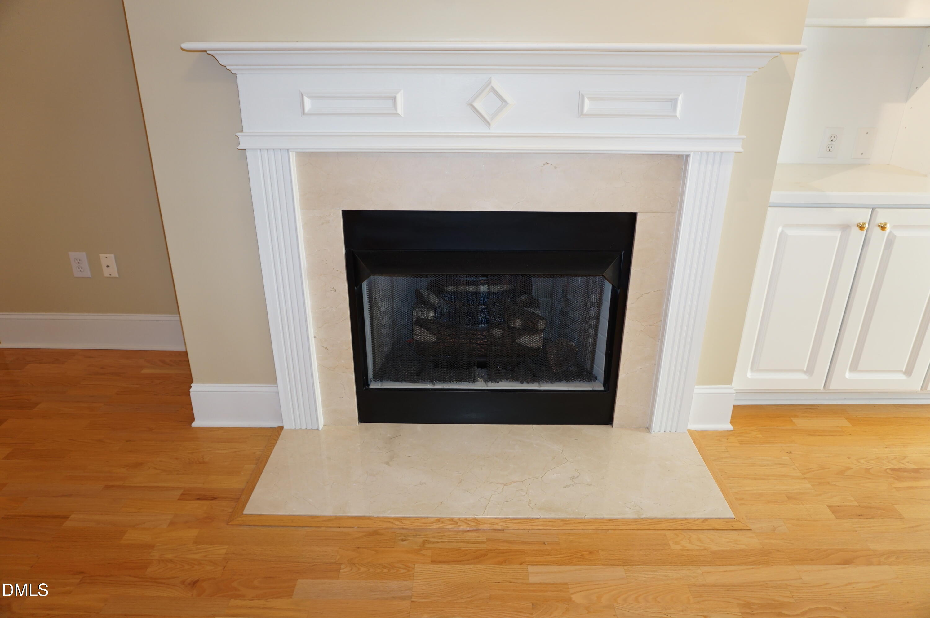 3701 Baron Cooper Pass, Unit 104 Raleigh, NC 27612 - Photo 23 of 52 a white building with a fireplace