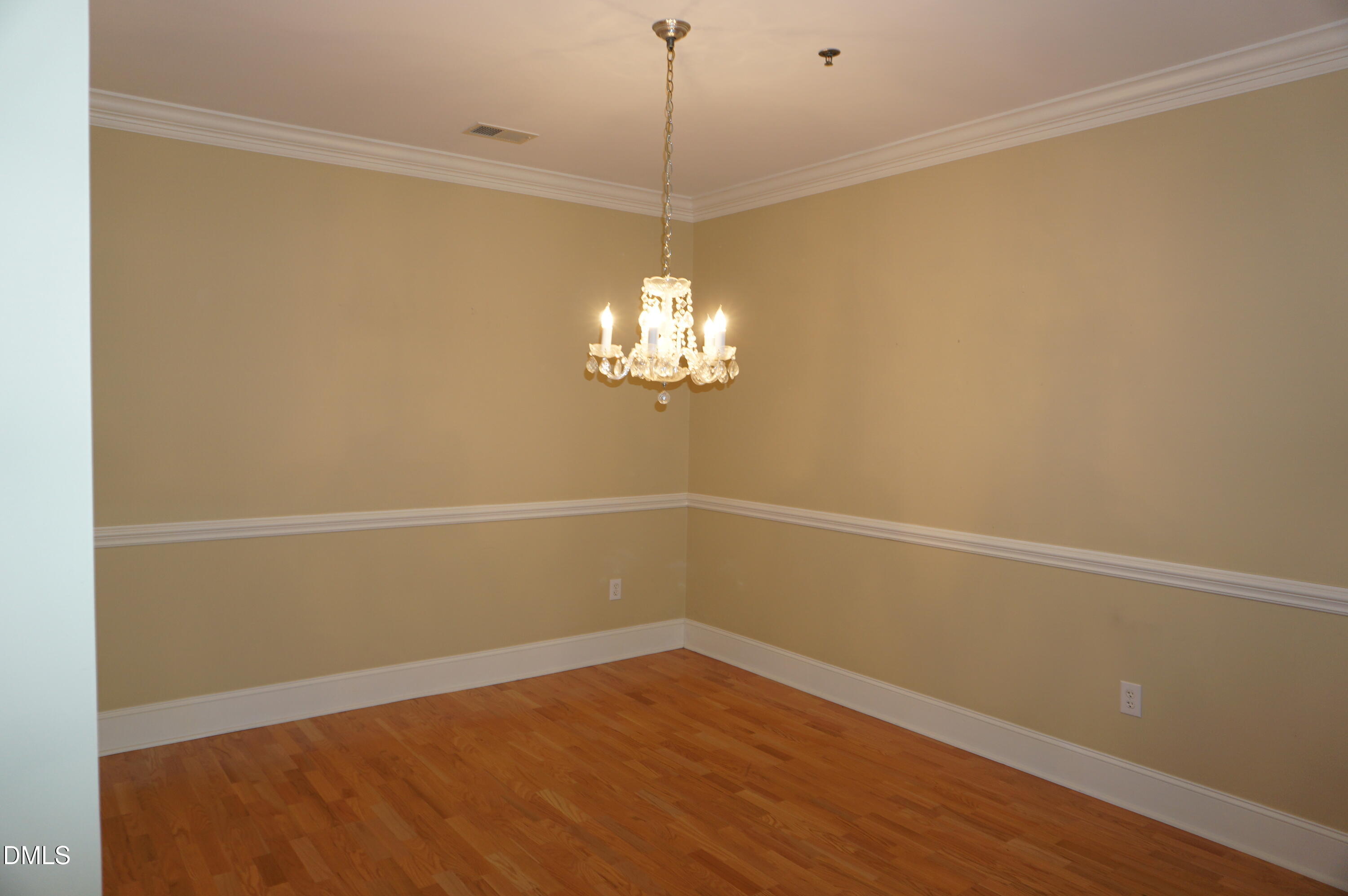 3701 Baron Cooper Pass, Unit 104 Raleigh, NC 27612 - Photo 25 of 52 a view of a room with window and wooden floor