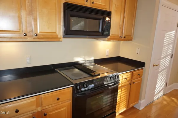 a kitchen with a sink and a window