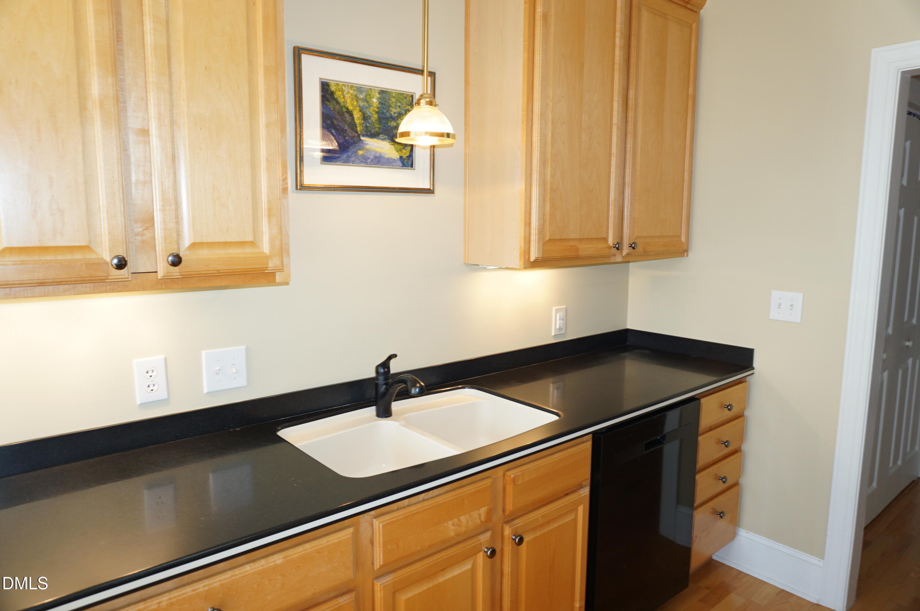 3701 Baron Cooper Pass, Unit 104 Raleigh, NC 27612 - Photo 29 of 52 a kitchen with a sink and a window
