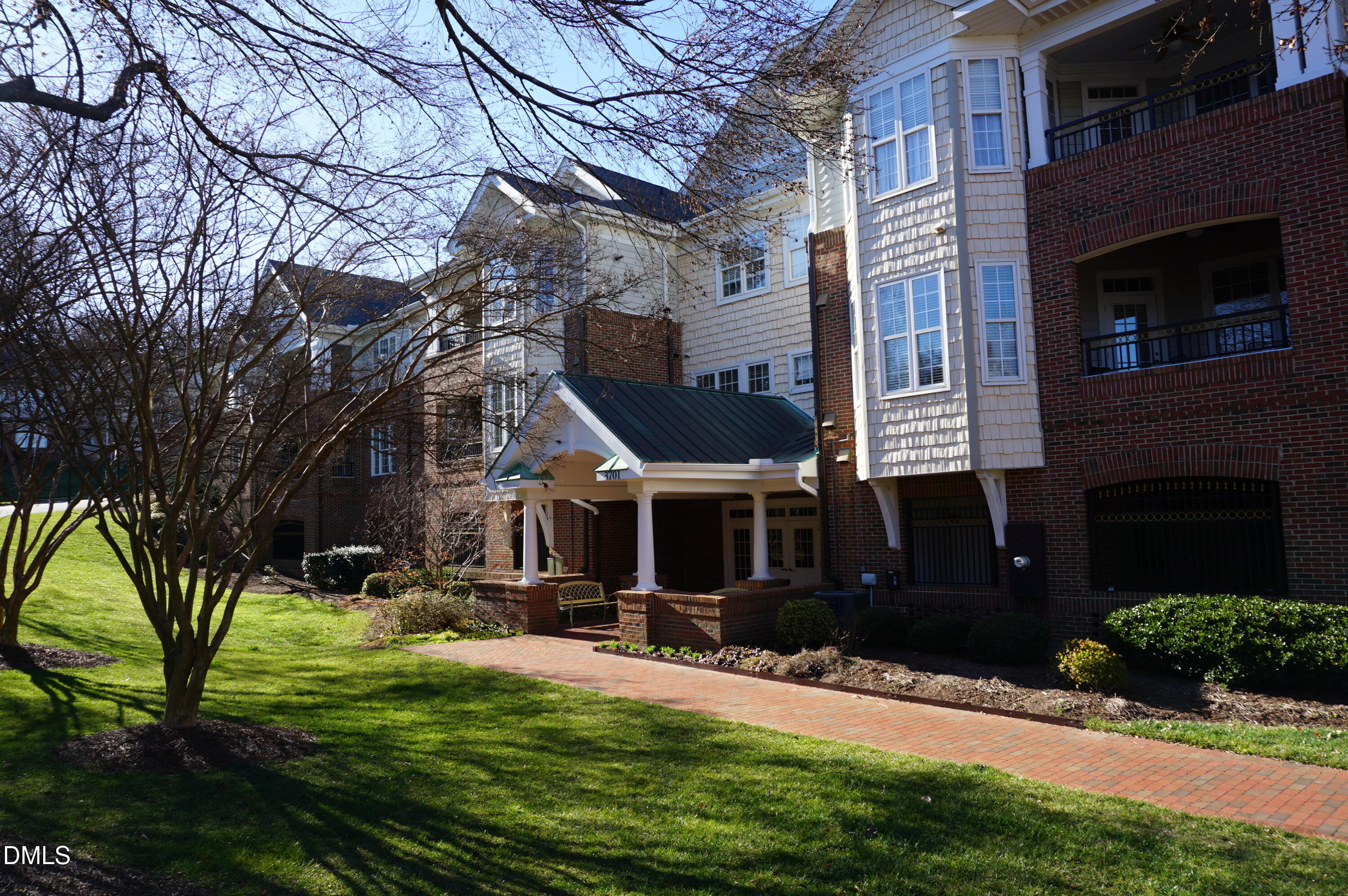 3701 Baron Cooper Pass, Unit 104 Raleigh, NC 27612 - Photo 3 of 52 a front view of a house with a yard