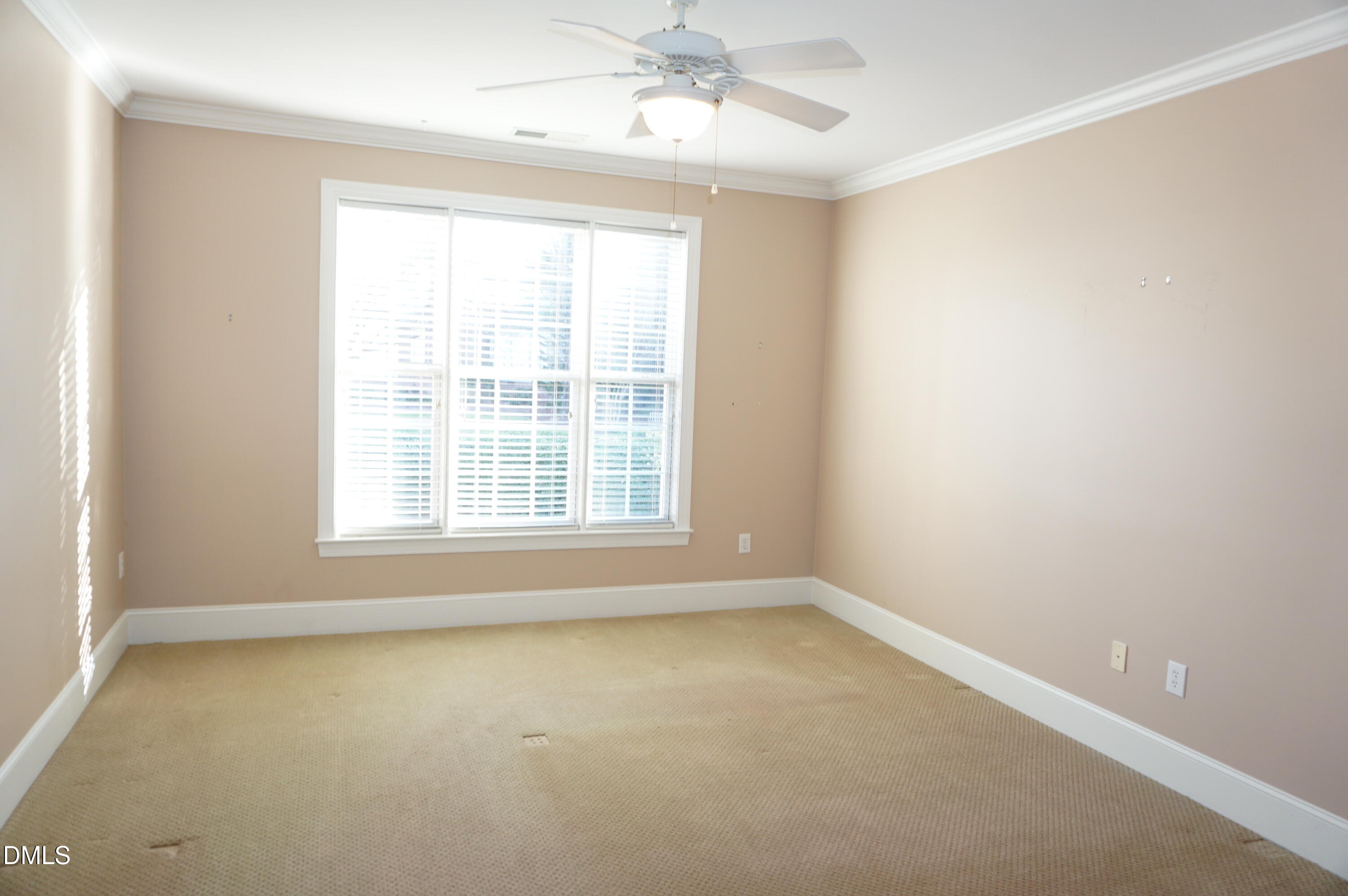 3701 Baron Cooper Pass, Unit 104 Raleigh, NC 27612 - Photo 32 of 52 an empty room with a window