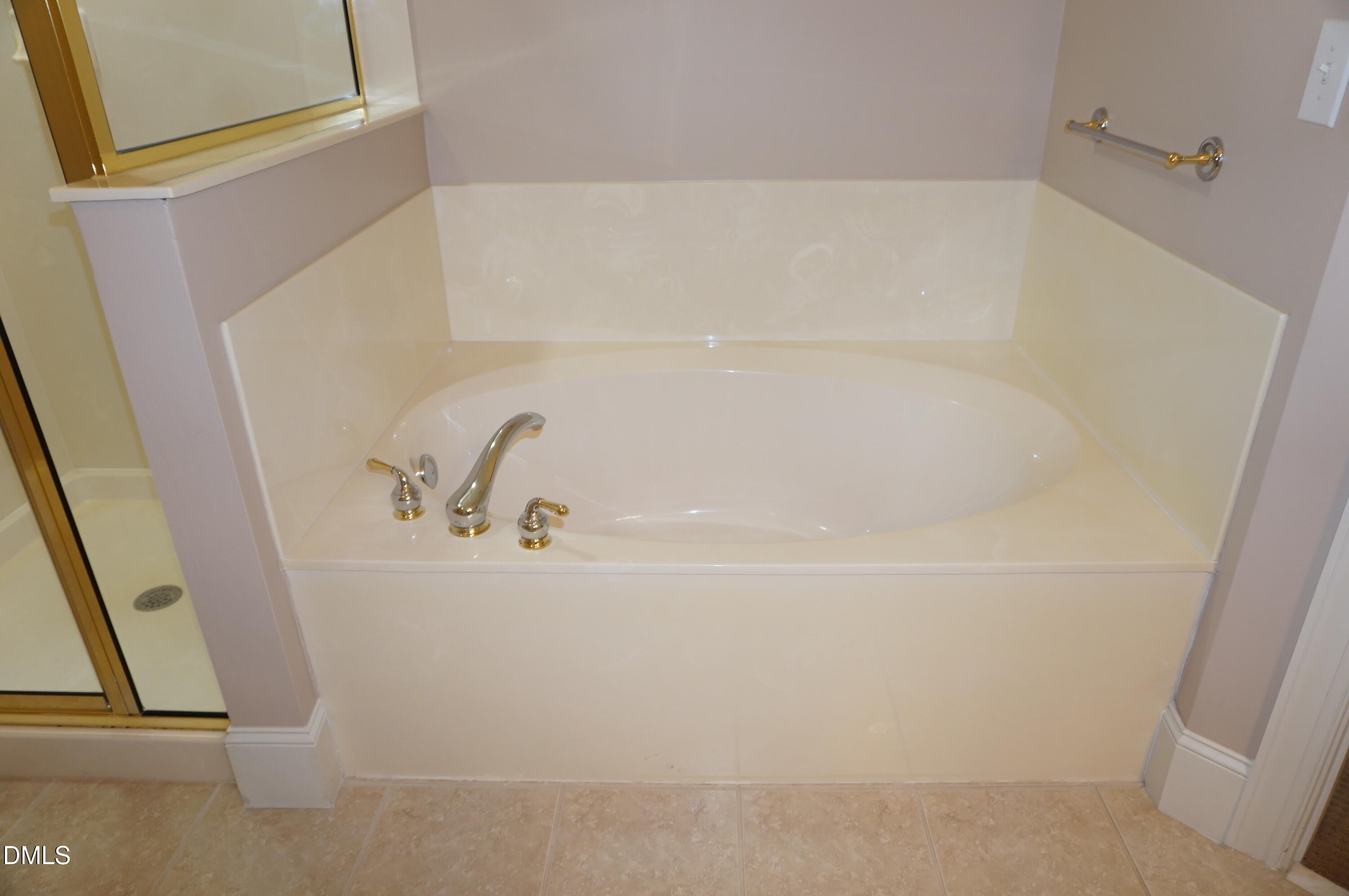3701 Baron Cooper Pass, Unit 104 Raleigh, NC 27612 - Photo 36 of 52 a close up of a bathtub