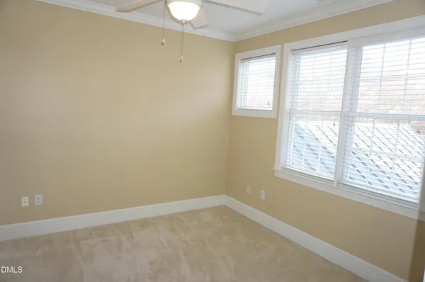 a bathroom with a sink a toilet and shower curtain