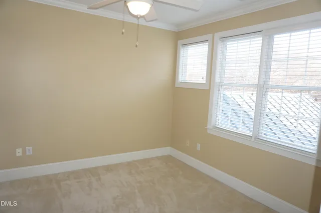 a bathroom with a sink a toilet and shower curtain
