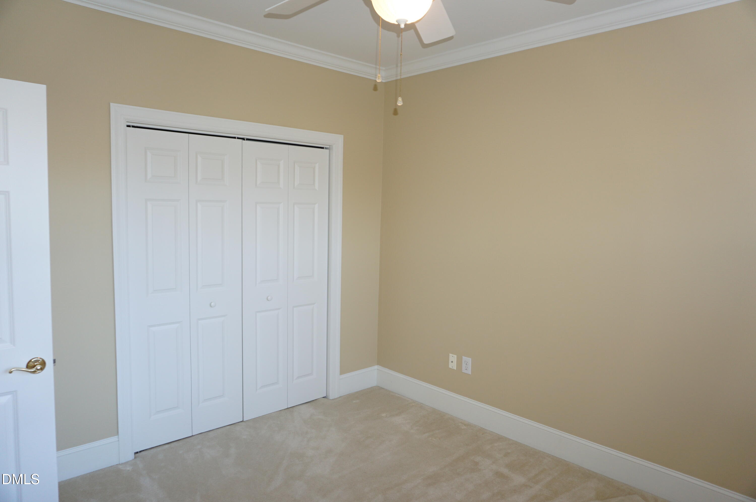3701 Baron Cooper Pass, Unit 104 Raleigh, NC 27612 - Photo 39 of 52 an empty room with a door