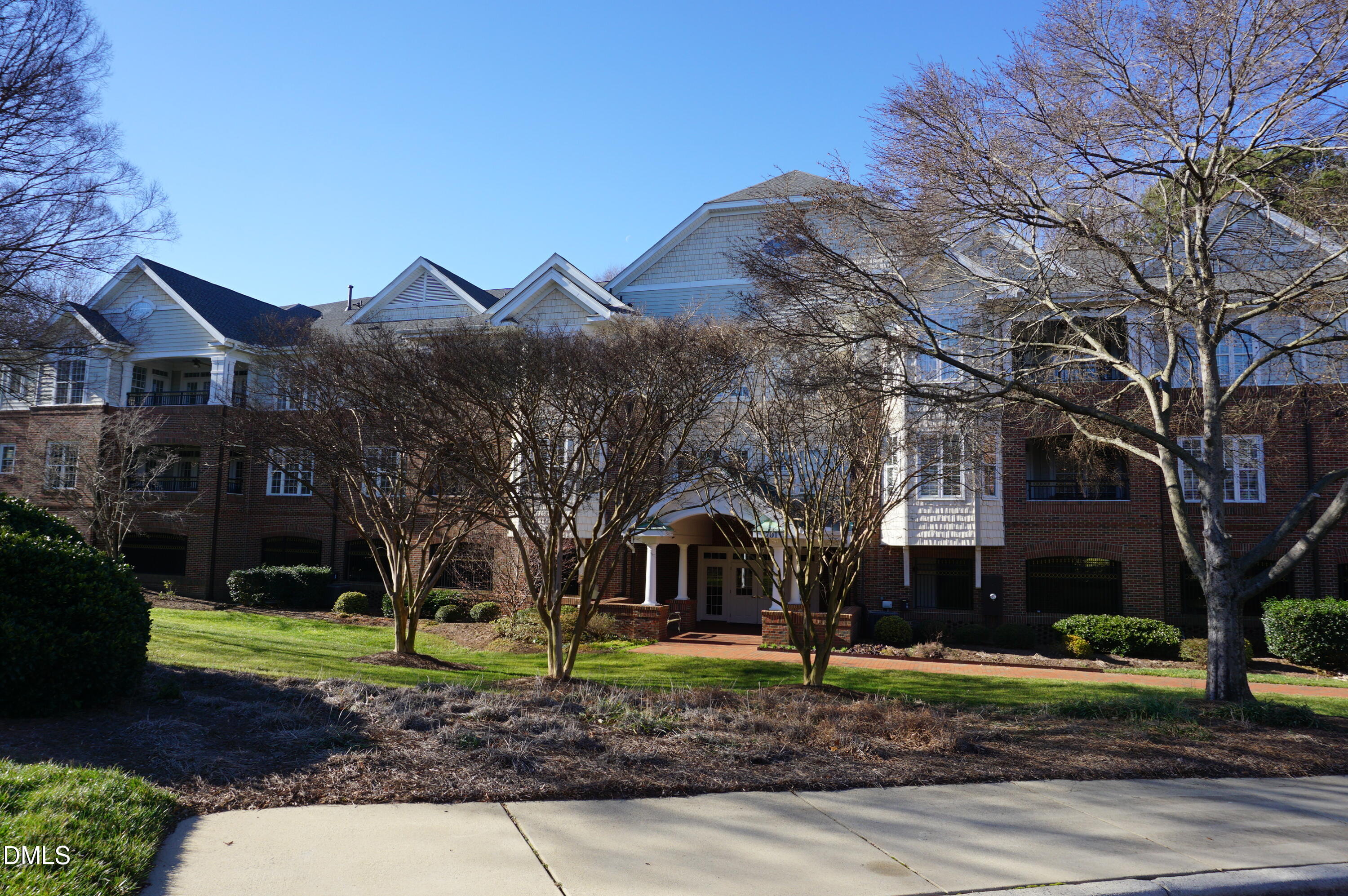 3701 Baron Cooper Pass, Unit 104 Raleigh, NC 27612 - Photo 4 of 52 a front view of a house with garden