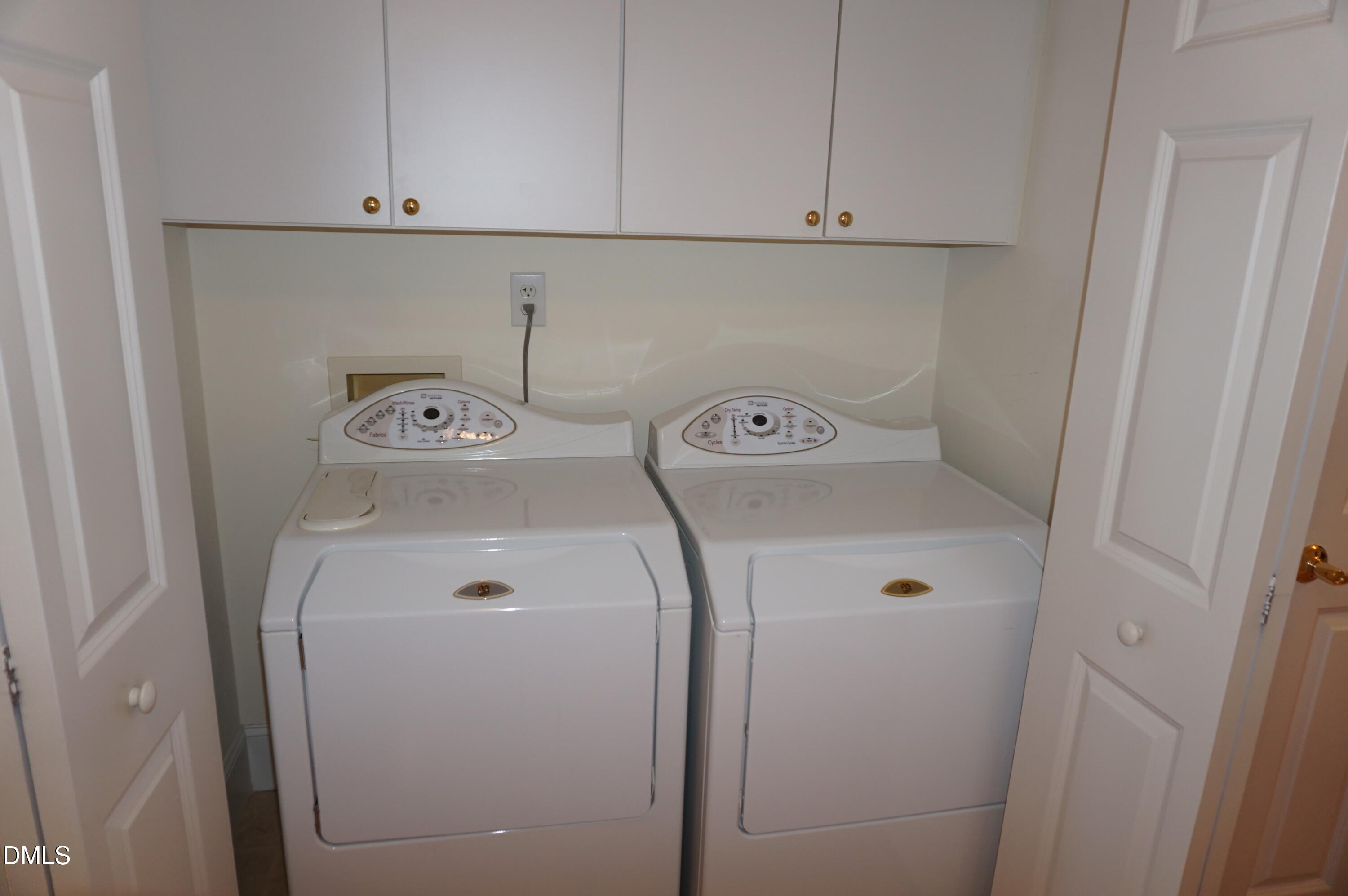3701 Baron Cooper Pass, Unit 104 Raleigh, NC 27612 - Photo 42 of 52 a utility room with dryer and washer