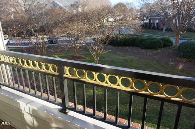 a view of balcony with wooden floor