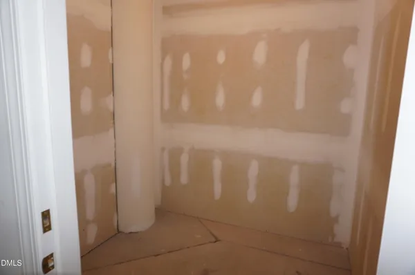 a view of a yard with large trees