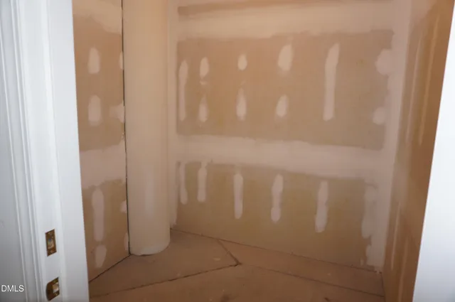 a view of a yard with large trees