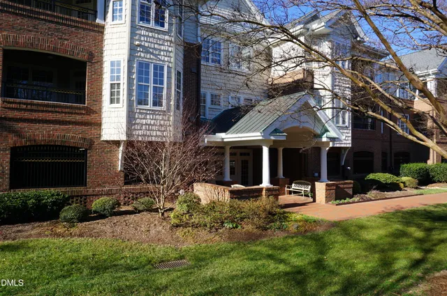 a view of a building with a yard