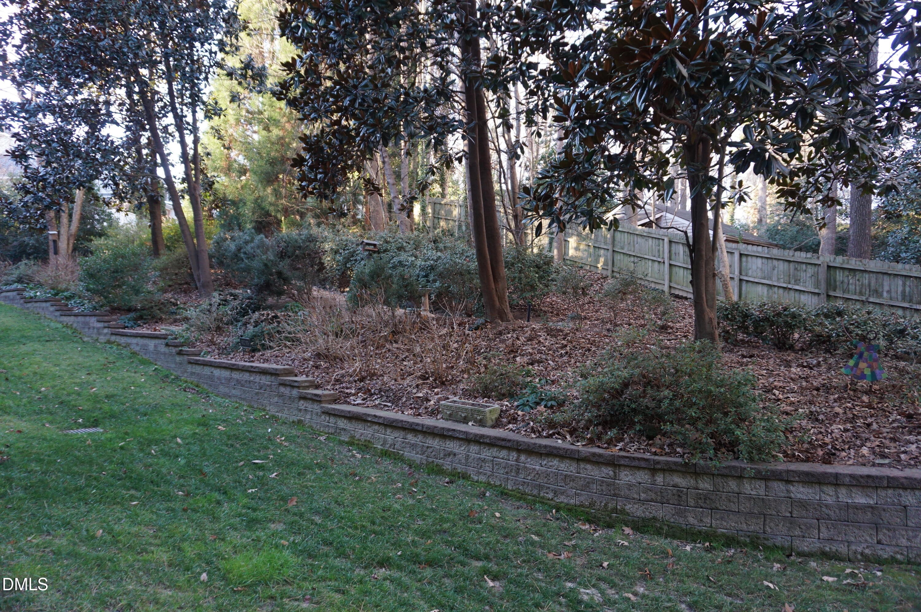 3701 Baron Cooper Pass, Unit 104 Raleigh, NC 27612 - Photo 52 of 52 a view of a yard with large trees