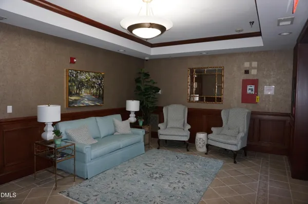 a living room with furniture and a rug