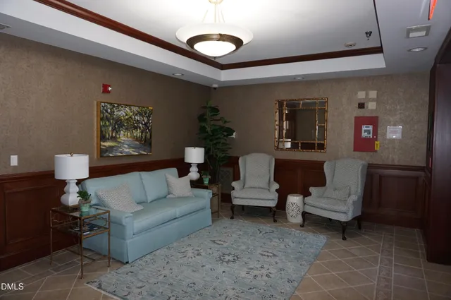 a living room with furniture and a rug