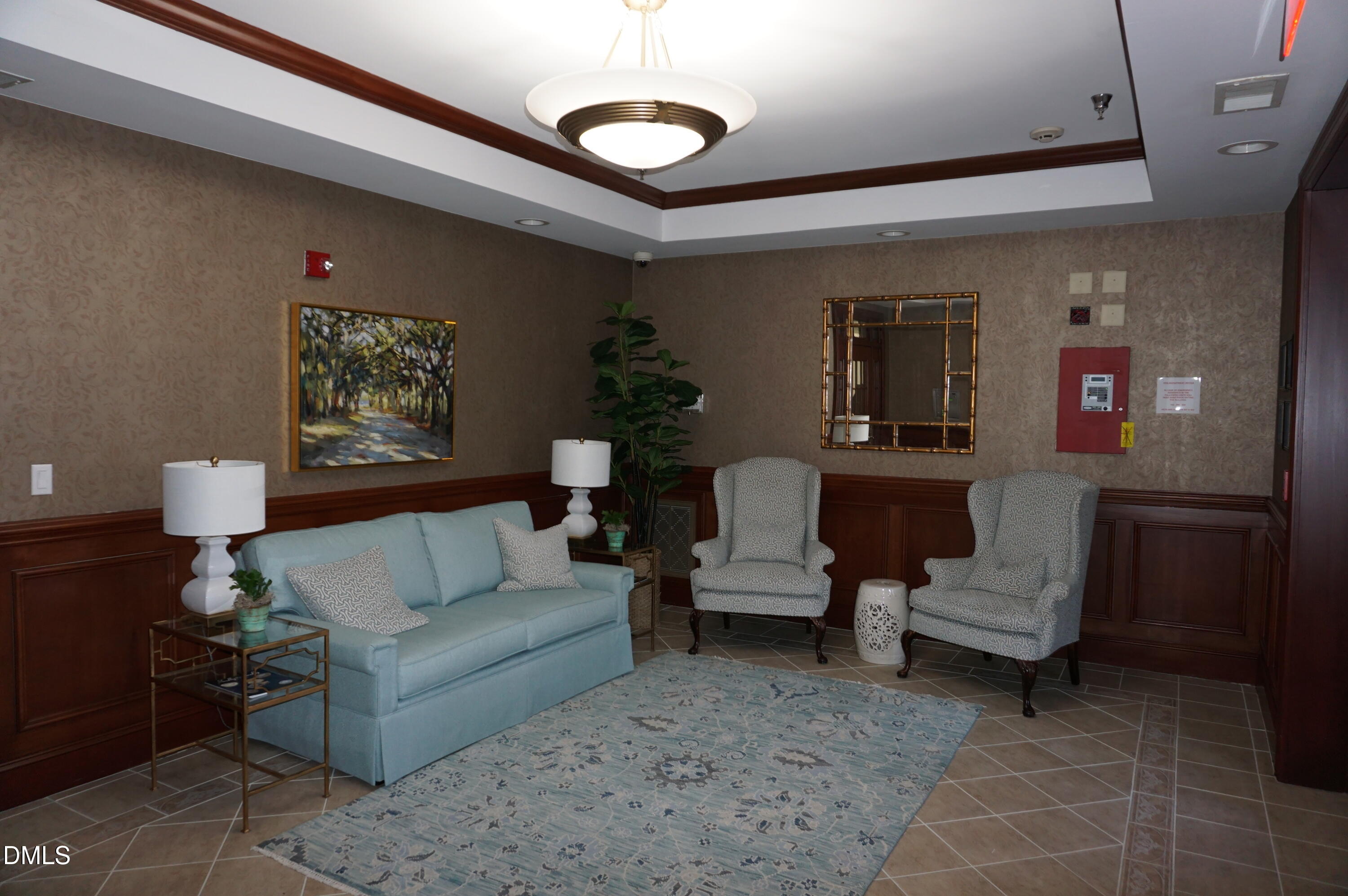 3701 Baron Cooper Pass, Unit 104 Raleigh, NC 27612 - Photo 8 of 52 a living room with furniture and a rug