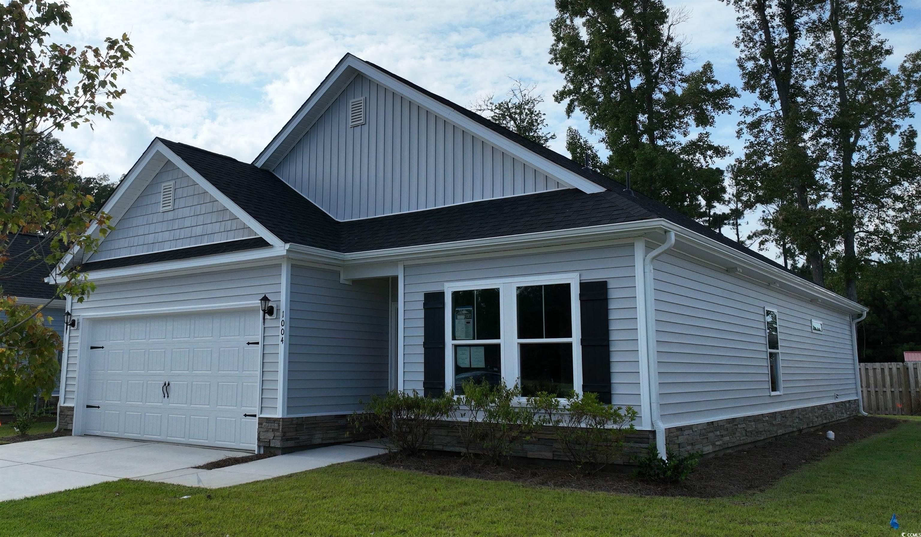 1048 Moen Loop, Unit LOT 13 Conway, SC 29526 - Photo 1 of 27 View of front of home with a front lawn, board and
