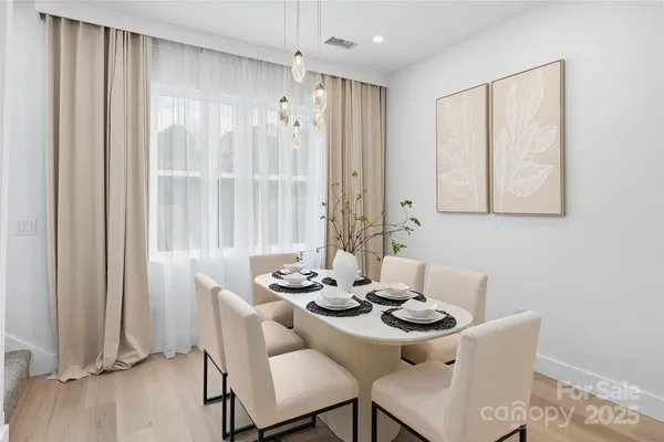 a dining room with furniture and window