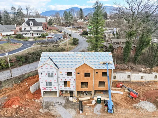 a view of residential houses with outdoor space