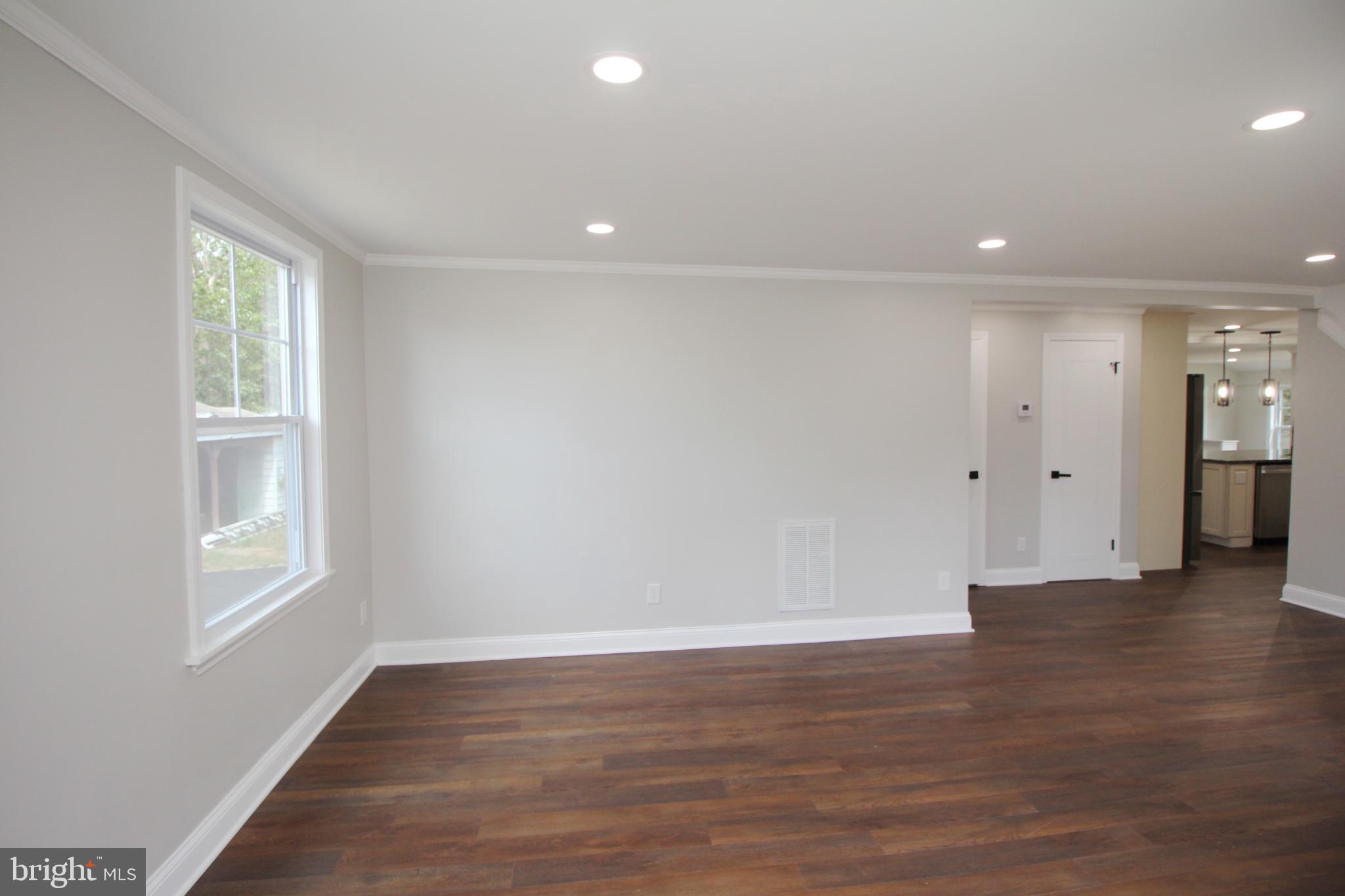 1588 Kearsley Road Sicklerville, NJ 08081 - Photo 16 of 36 an empty room with wooden floor and windows