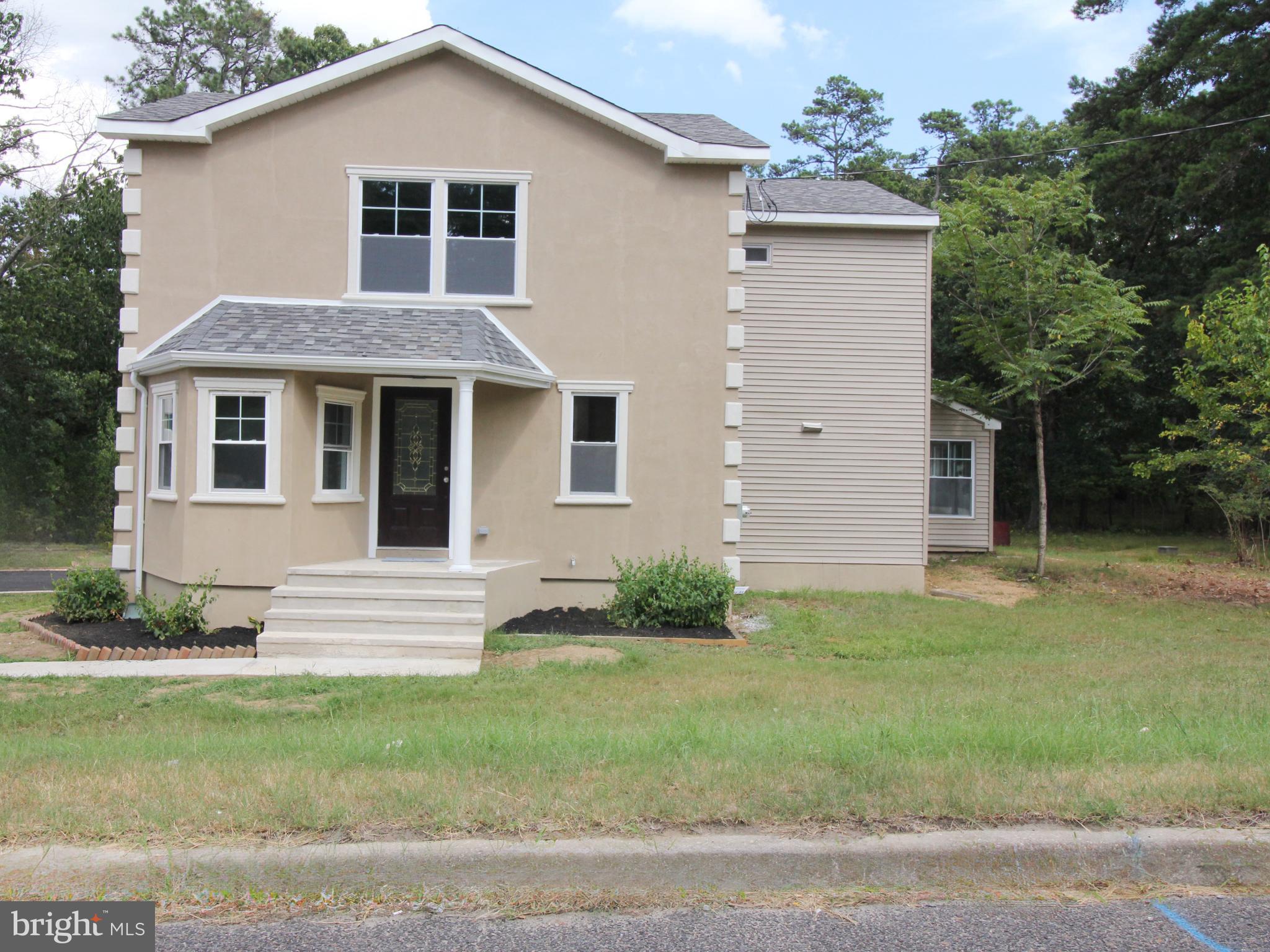 1588 Kearsley Road Sicklerville, NJ 08081 - Photo 2 of 36 a front view of a house with a garden
