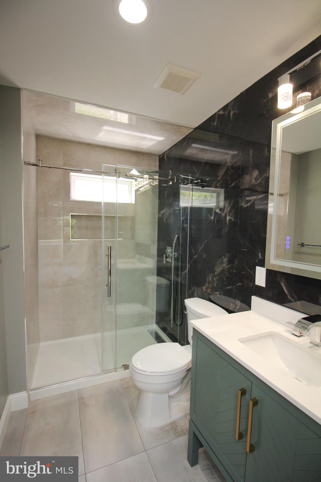 1588 Kearsley Road Sicklerville, NJ 08081 - Photo 22 of 36 a bathroom with a sink a toilet and shower