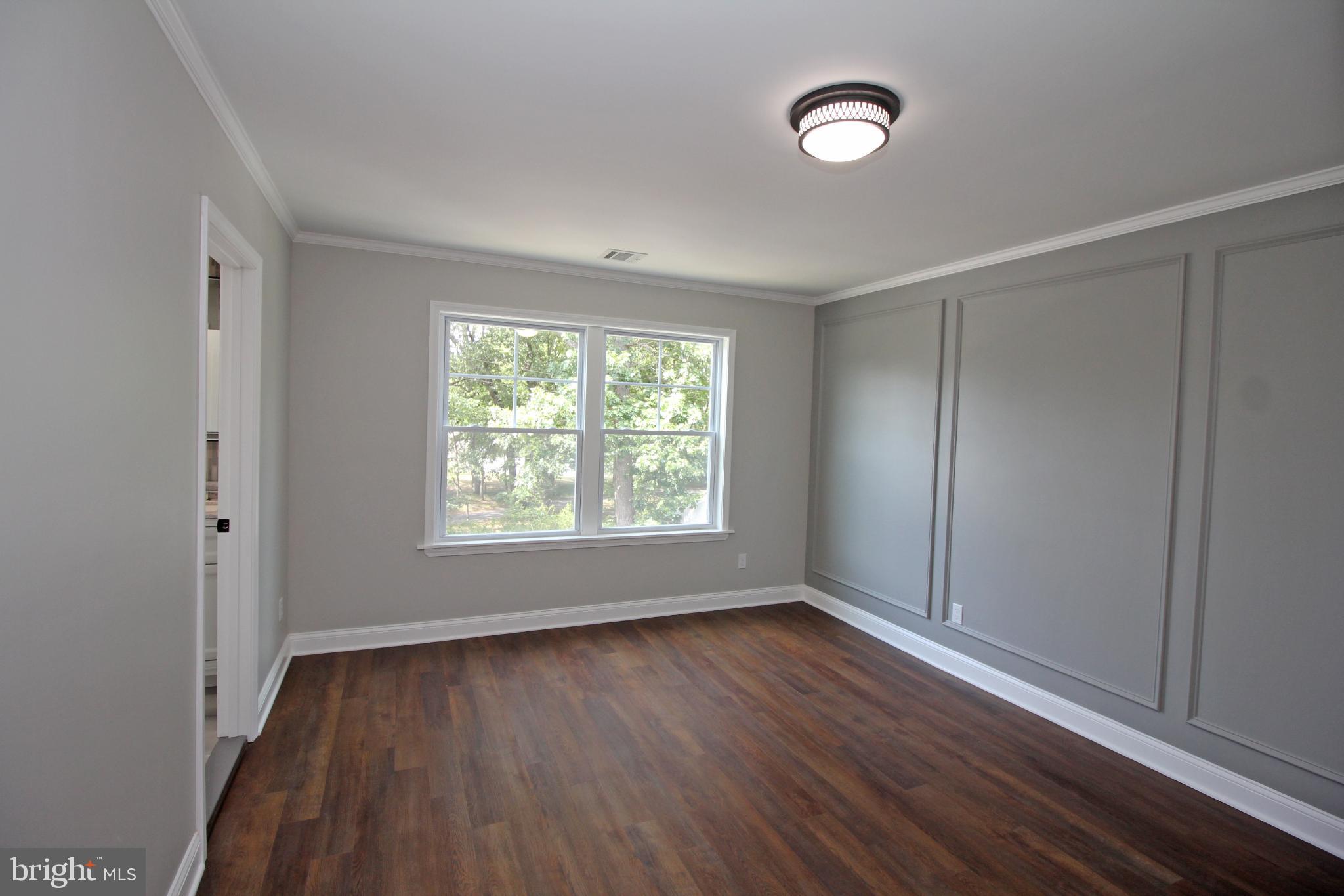 1588 Kearsley Road Sicklerville, NJ 08081 - Photo 24 of 36 a view of an empty room with wooden floor and a window