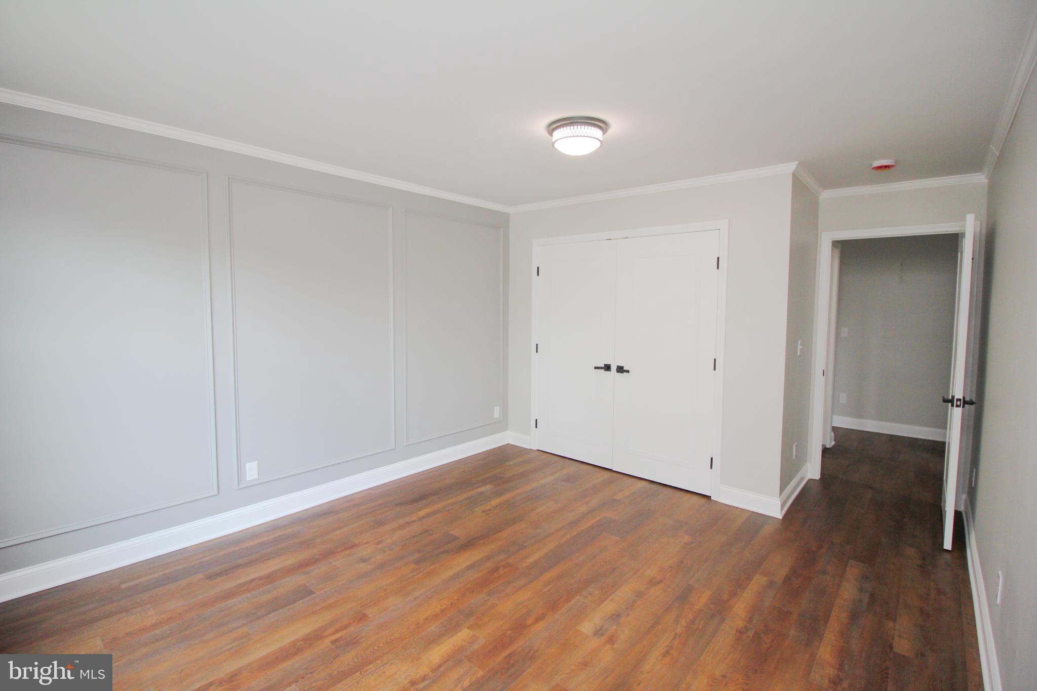1588 Kearsley Road Sicklerville, NJ 08081 - Photo 26 of 36 a view of an empty room with wooden floor