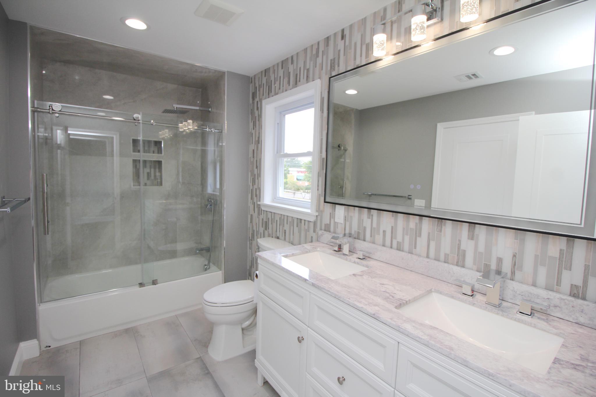 1588 Kearsley Road Sicklerville, NJ 08081 - Photo 28 of 36 a bathroom with a bathtub shower sink and toilet