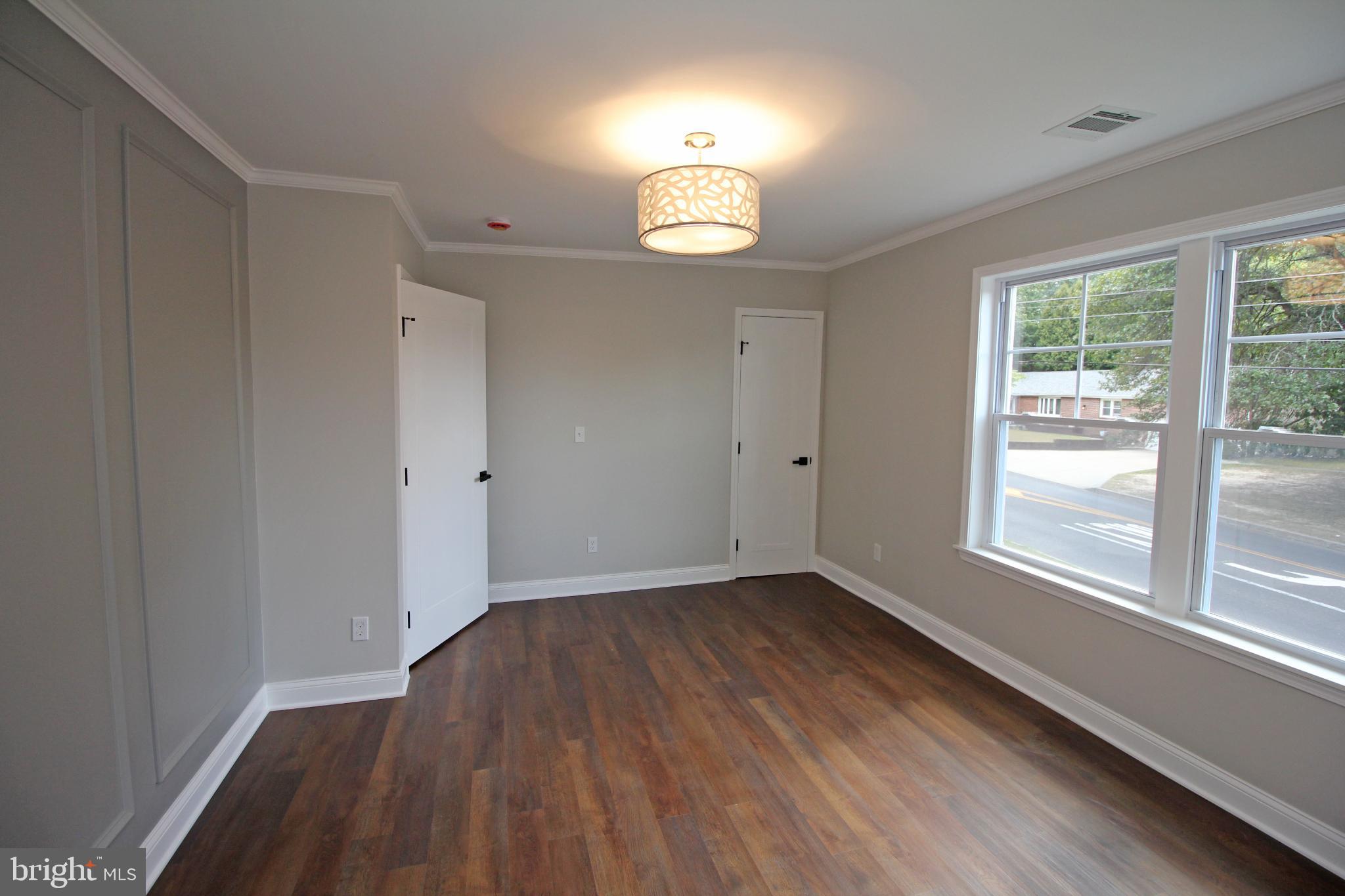 1588 Kearsley Road Sicklerville, NJ 08081 - Photo 30 of 36 a view of an empty room with wooden floor and a window
