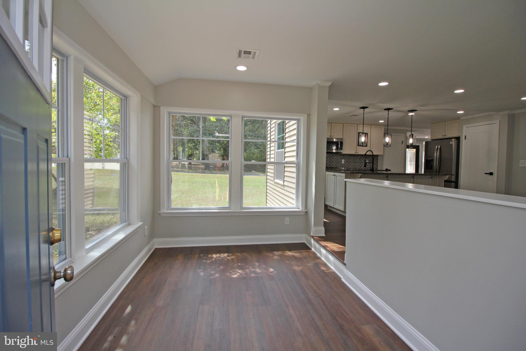 1588 Kearsley Road Sicklerville, NJ 08081 - Photo 8 of 36 a view of a kitchen with wooden floor and a window