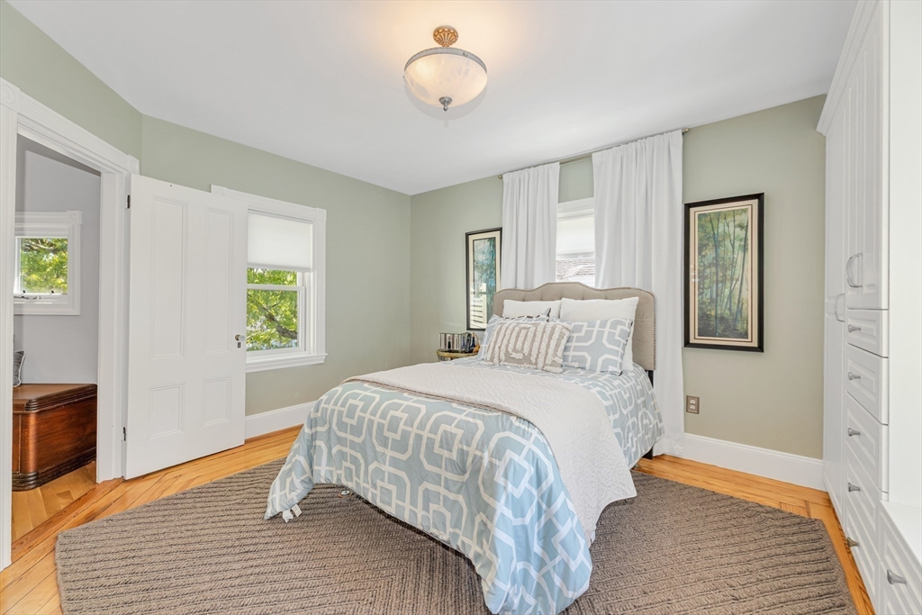 112 Perham Street Boston, MA 02132 - Photo 25 of 36 a bedroom with a bed and window